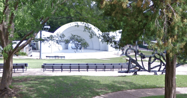 Historic outdoor amphitheater with trees and benches in Memphis Heritage Park, showcasing Memphis cultural landmarks and community gathering spaces.