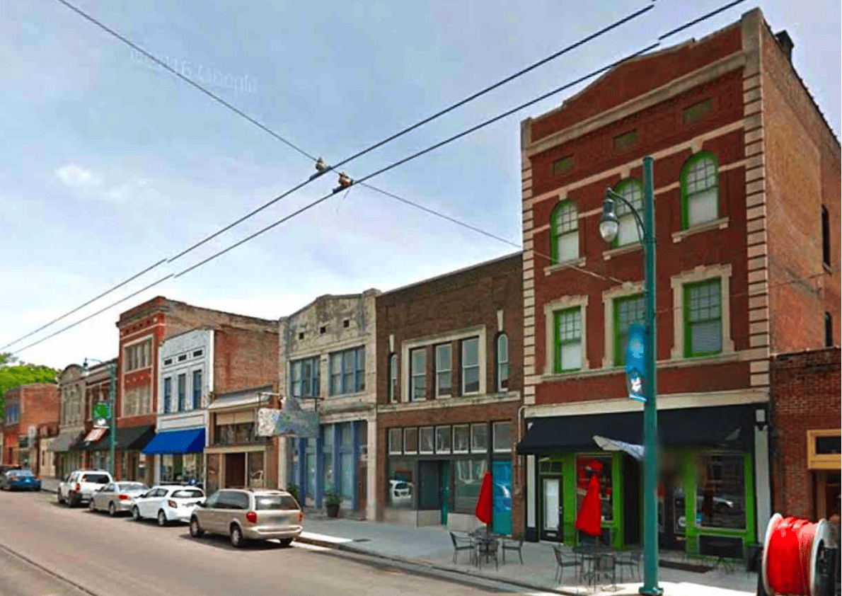 Vintage storefronts on Main Street in Memphis, Tennessee, showcasing historic architecture and vibrant local businesses, emphasizing Memphis Heritage Inc.'s dedication to preserving Memphis’s cultural heritage.